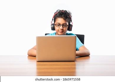 Indian Male Syudent Or Kid Studying Online Using Laptop. Asian Child Attending Online School Using Computer