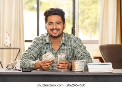 Indian Man Counting Money He Saved For Education