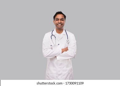 Indian Man Doctor Smiling Hands Crossed Isolated. Healthy Life, Medicine Concept.