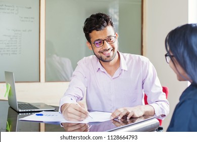 Indian Man Explaining Contract To A Colleague