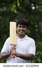 Indian Man Holding Cricket Bat