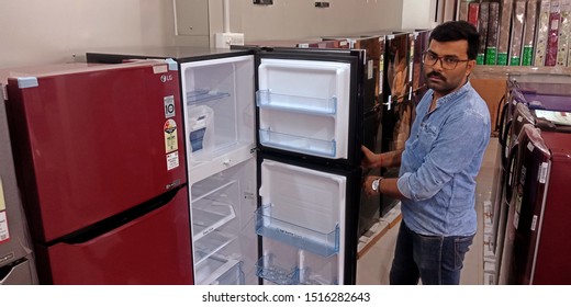 An Indian Man Opening Refrigerator Door Into The Showroom At District Katni Madhya Pradesh In India Shot Captured On Sep 2019