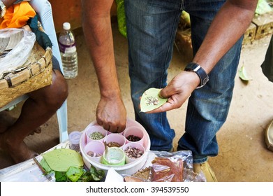 Indian Man Preparing Betel For Chewing