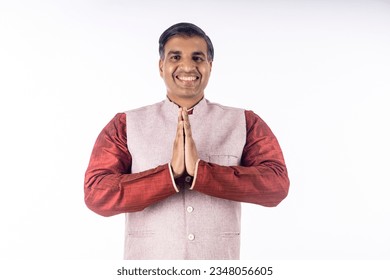 Indian man Showing Namaste or welcome gesture, on White Background.