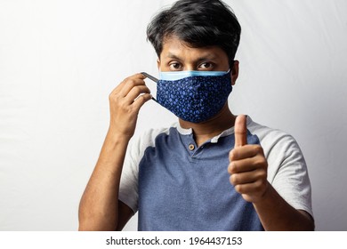 An Indian Man Shows Thumbs Up To Double Masking During Covid-19 Pandemic, Healthcare Concept