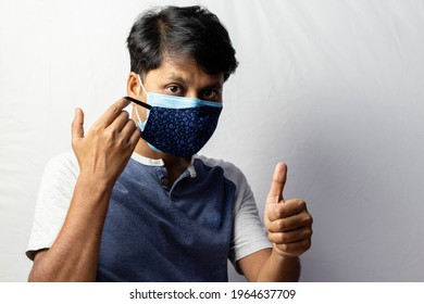 An Indian Man Shows Thumbs Up To Double Masking During Covid-19 Pandemic, Healthcare Concept