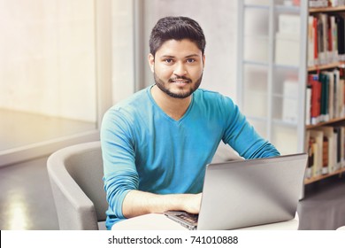 Indian Man Working On Laptop