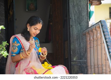 Indian Married Woman Preparing Marigold Garland During Diwali Festival, Celebration, House Warming, Pooja At Home. Fresh, Natural, Smell, Traditional Clothes, Culture, Smile, Happy, Flowers, Colors