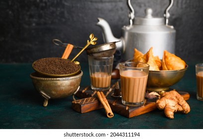 Indian Masala Chai Spice Tea With Kettle, Samosa And Spices On Dark  Background. Cafe, Bar, Restaurant, Hotel Concepts.