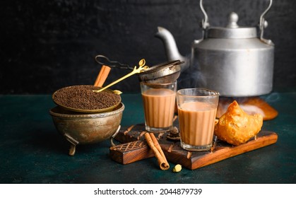 Indian Masala Chai Spice Tea With Kettle, Samosa And Spices On Dark  Background. Cafe, Bar, Restaurant, Hotel Concepts.