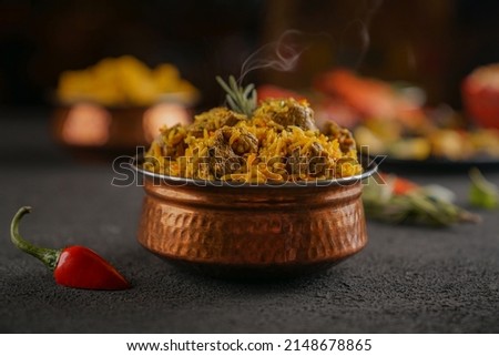 indian meat biryani,
Spicy mutton biryani food photography
