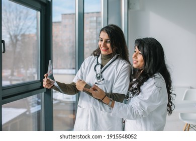 Indian medical students interns analyze the X-ray in a modern clinic. Indian doctor