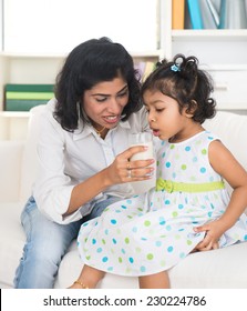 Indian Mother And Child Drinking Milk