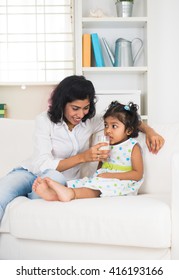 Indian Mother And Child Drinking Milk

