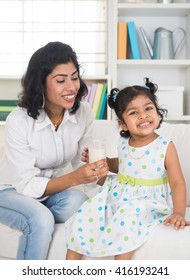 Indian Mother And Child Drinking Milk

