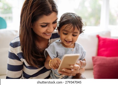 Indian Mother And Child Playing Game On The Smartphone