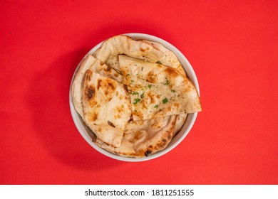 Indian Naan Bread On Red Table