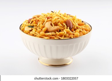 Indian Namkeen Snacks served in ceramic bowl & plate or Indian traditional Namkeen Food  Mixture or Navratna Mix Namkeen Also Know as Nimco, Namkin, Mixture ,chiwda or Nimko  - Shutterstock ID 1803322057