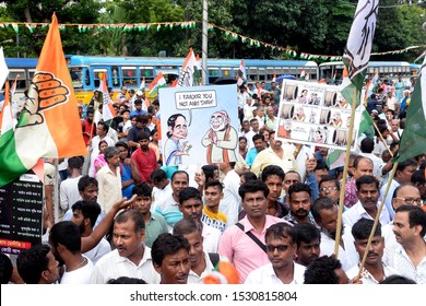 Indian National Congress Activist Hold Congress Flag And Poster During A Protest Against State And Union Government On September 12, 2019 In Calcutta, India.