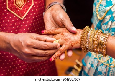 Indian Newlyweds Wearing Rings To Each Other.