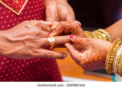 Indian Newlyweds Wearing Rings To Each Other.