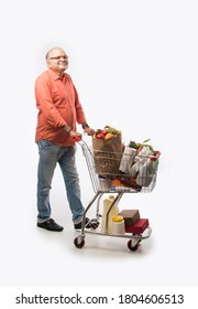 Indian Old Man With Shopping Cart Or Trolly Full Of Vegetables, Fruits And Groceries