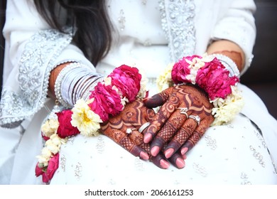 Indian Pakistan Bridal showing hands wedding jewllery and henna design, Bride showing wedding mehndi design 