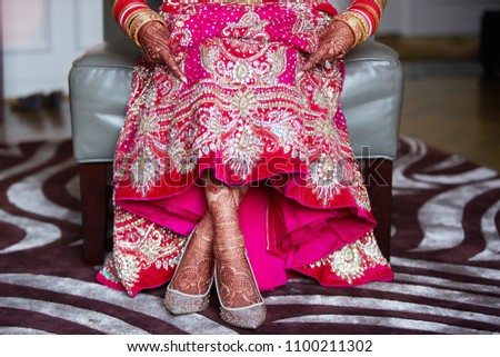 Indian Pakistani Bride Showing her Mendhi Design on feets