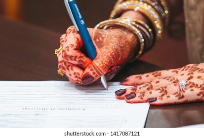 Indian Pakistani Bride Signing Nikkah Paper. Karachi - June 06 2019