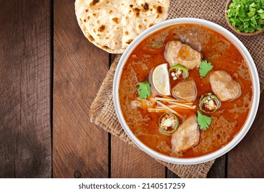 Indian, Pakistani Desi Food Nihari With Naan. Wooden Background.