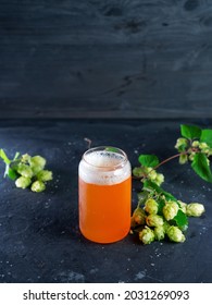 Indian pale ale, a glass of craft beer and green hops - Shutterstock ID 2031269093
