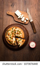 Indian Paneer Pizza With Fresh Cottage Cheese Cubes And White Sauce