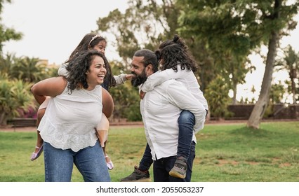 Indian Parents Having Fun With Children At City Park - Hindu Family Enjoy Day Outdoor