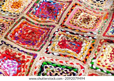 Indian patchwork carpet in Pune, Colorful Indian style rug surface close up vintage fabric is made of hand-woven cotton fabric More of this motif.