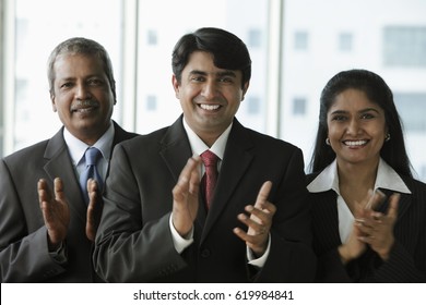 Indian People Clapping And Smiling