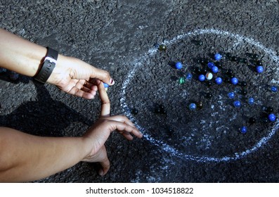  Indian People Play Marbles On The Road Outdoors On Physical Literacy Days Sunday Mornings On Open Roads In Hyderabad 