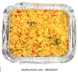 Indian pilau rice in takeaway foil container.