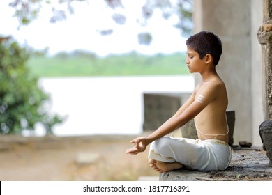 Indian Priest Child Doing Yoga At Park