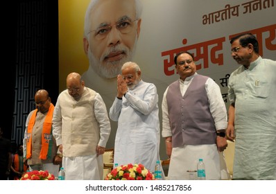 Indian Prime Minister Narendra Modi Greets Party MP's, Home Minister And President Of The Ruling Bhartiya Janta Party Amit Shah (on Left) And Party Working President Jai Prakash Nadda During A Party 