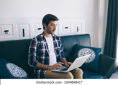 Indian IT Professional Working Remotely With Program Code For Database Installation, South Asian Man Typing Text On Modern Laptop Computer Using Home Internet Connection For Doing Distance Job