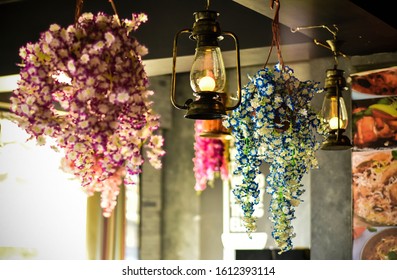 Indian Restaurant Interior With Vintage Light Bulbs. Vintage Village Style Restaurant Lights With Flower And Floral Decoration Concept