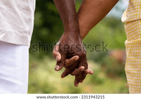 Indian retired couple enjoying a well-deserved vacation while holding hands. Stock photo © 