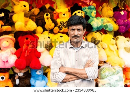 Indian roadside soft toy shop, seller looking at camera