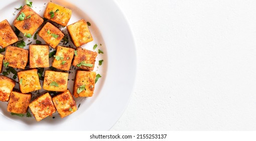 Indian Roasted Cottage Cheese Bites On Plate Over White Background With Copy Space. Top View, Flat Lay