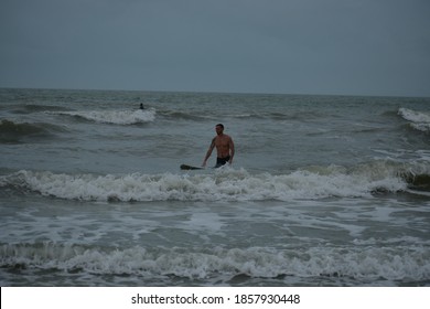 Indian Rocks Beach, Florida USA 11/12/2020. Surfing In The Gulf Of Mexico In Florida During Hurricane Season. 