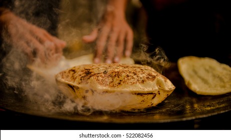 Indian Roti Or Bread Being Baked On A Pan