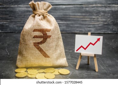 Indian Rupee INR Symbol Money Bag And Red Trend Arrow Up Chart. Deposit And Savings. Increasing Profits And Revenues, Capital Growth, Profitable Business Efficiency. Economic Prosperity Welfare Rise