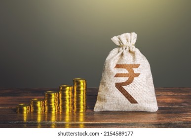 Indian rupee money bag and increasing stacks of coins. Rise in profits, budget fees. Investments. Raise incomes, increase salaries. Financial success. Economic growth, GDP. Savings and accumulation.