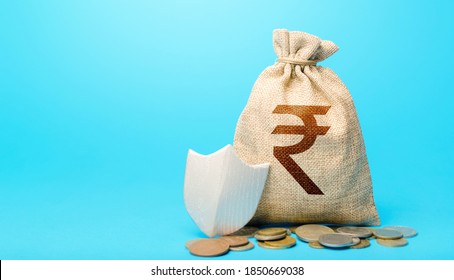 Indian rupee money bag and protection shield. Avoiding loss of funds during inflation. Financial instruments. Guarantee protection savings and investments. Secured loan. Ease doing business. - Shutterstock ID 1850669038