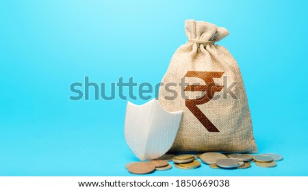 Indian rupee money bag and protection shield. Avoiding loss of funds during inflation. Financial instruments. Guarantee protection savings and investments. Secured loan. Ease doing business.